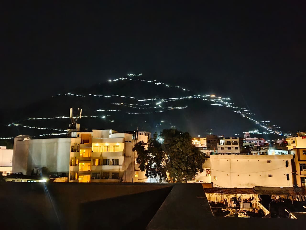 Illuminated Hilltop City Night View